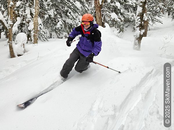 Telemark skier slices through powder snow