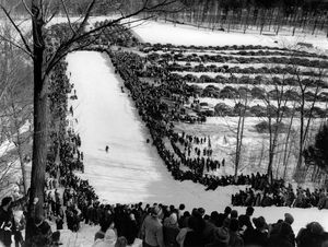 In this historic photo, the crowd lines the hill