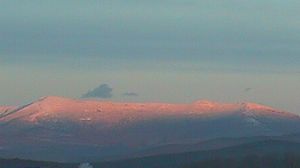 Snowy Mt. Mansfield in the glow of the setting sun in Vermont.